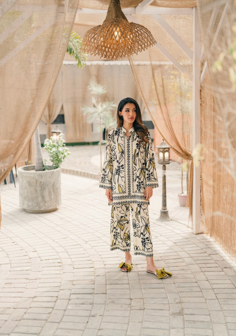 "White Shalwa Kameez With Black & Yellow Floral Print'