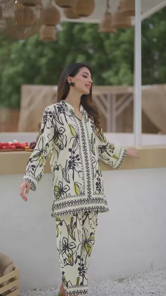"White Shalwa Kameez With Black & Yellow Floral Print'